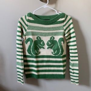 Green and cream knit sweater